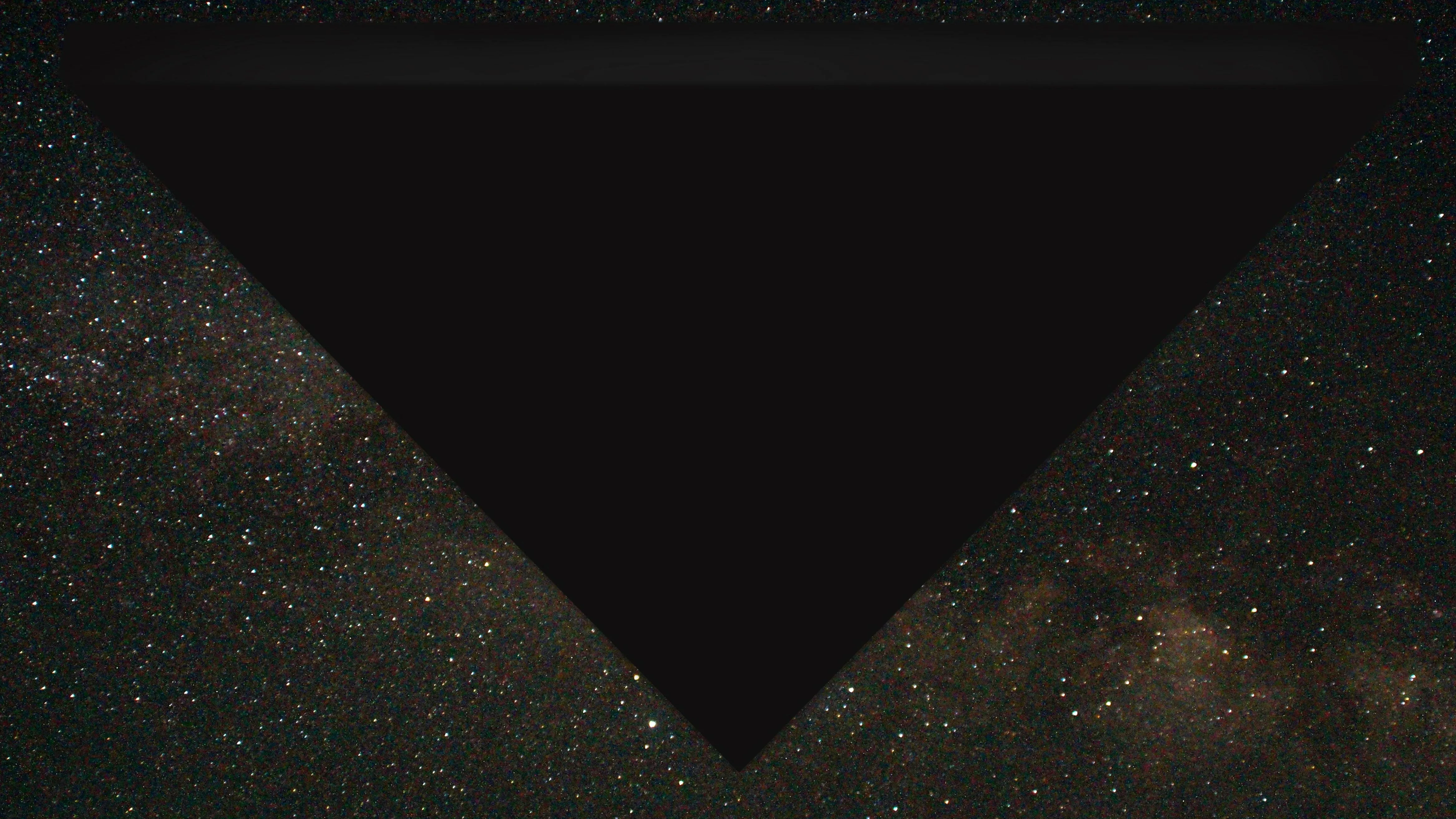 FBI digital rendering of a vast black equilateral triangle passing overhead against a dense star field, blotting out the stars including part of the Milky Way.